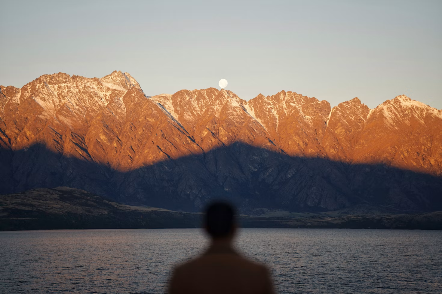 Golden evening light on Queenstown’s mountains above Lake Wakatipu